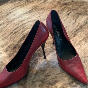 Prada “burnt” red pumps
